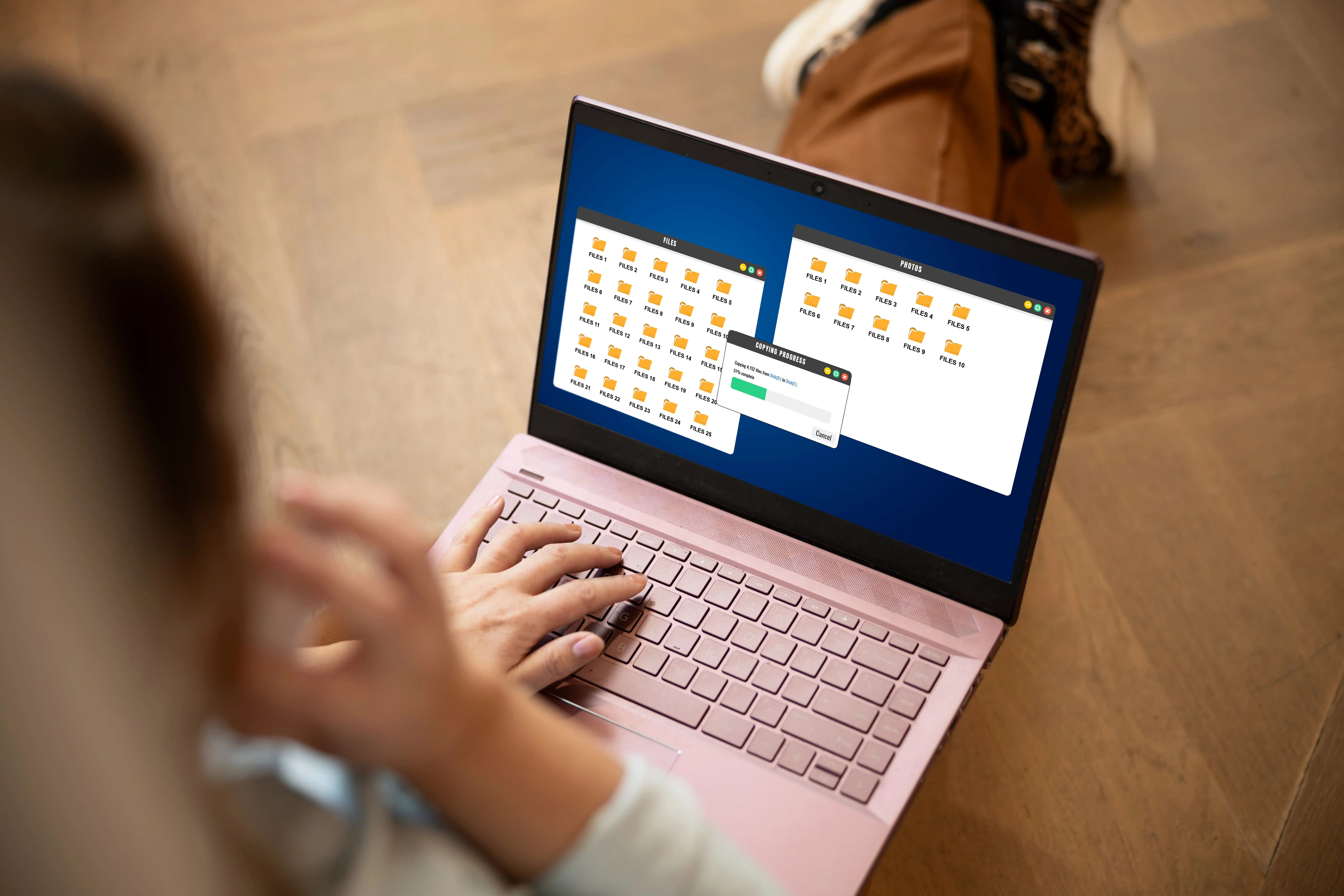 Representation d'un pc avec a l'ecran un transfert de fichier et une barre de chargement.